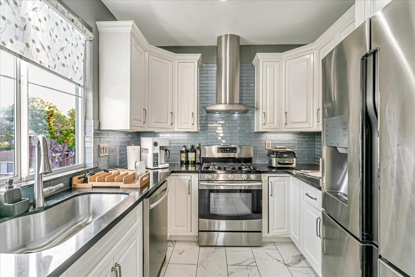 3657 Jasmine Circle San Jose, CA 95135 - Photo 3 of 62 a kitchen with stainless steel appliances granite countertop a sink stove and refrigerator