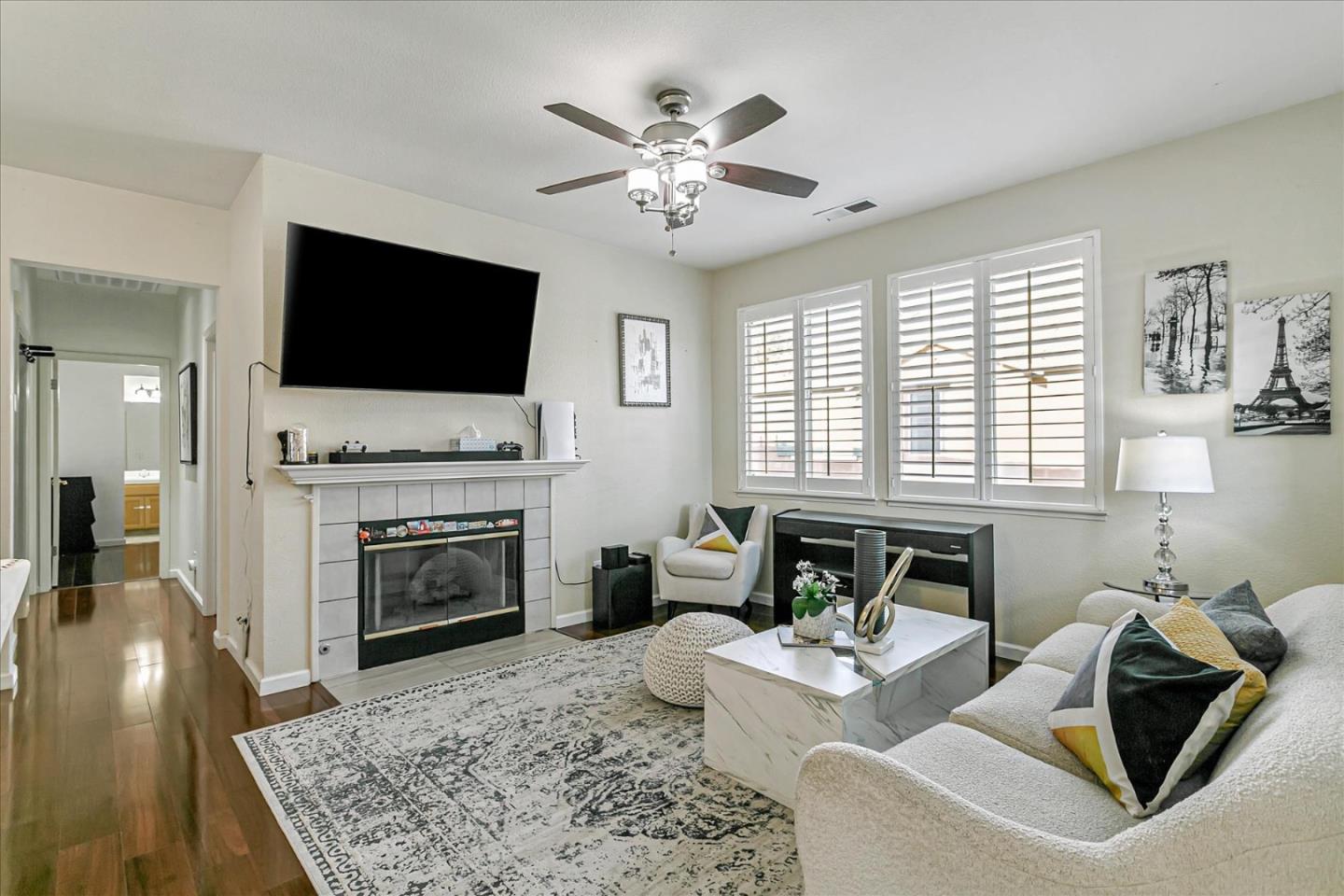 3657 Jasmine Circle San Jose, CA 95135 - Photo 4 of 62 a living room with furniture a fireplace and a flat screen tv