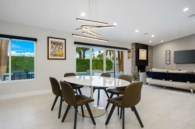 a view of a dining room with furniture and window