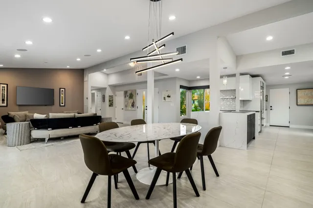 a view of a dining room with furniture window and outside view