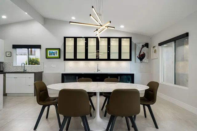 a kitchen with a sink stainless steel appliances and cabinets