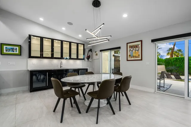 a large kitchen with a table and chairs