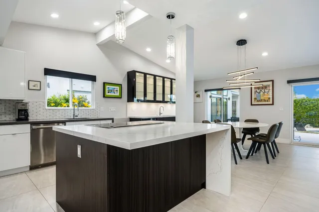 a view of a kitchen with refrigerator and microwave