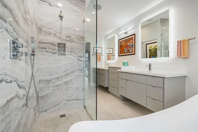 a view of a patio with table and chairs a barbeque with wooden floor and fence