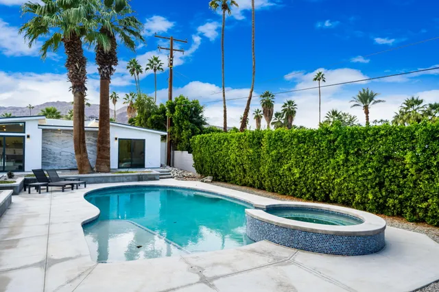 a kitchen with stainless steel appliances kitchen island a refrigerator sink and stove