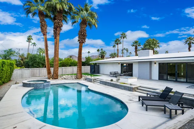 an aerial view of a house with a garden