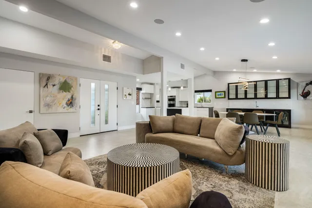 a kitchen with stainless steel appliances kitchen island granite countertop a sink and cabinets