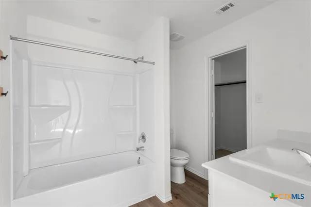 a bathroom with a bathtub and a sink