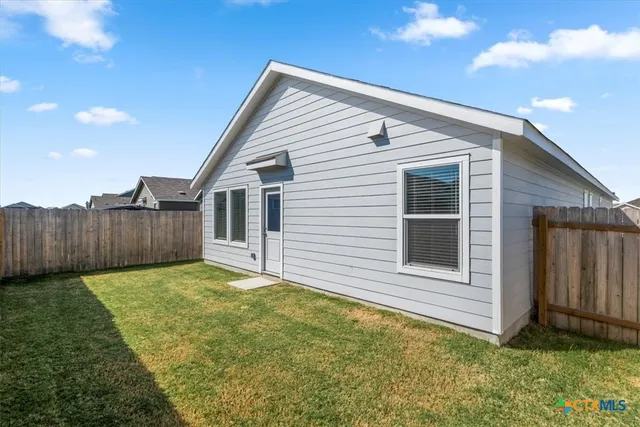 a view of a backyard of the house