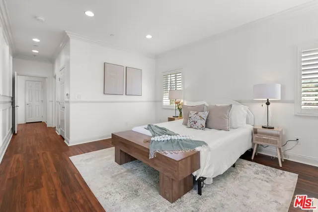 a bedroom with a bed and a table