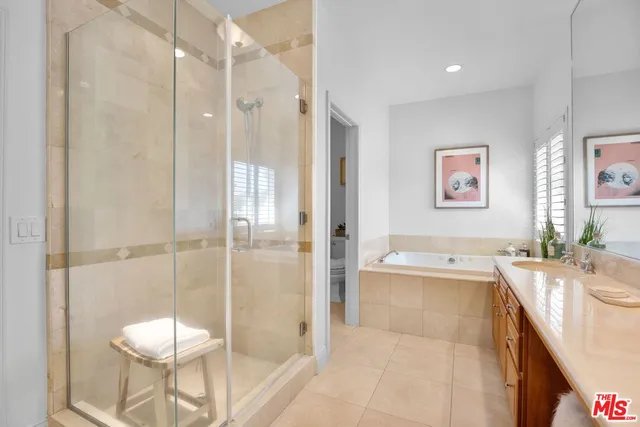 a bathroom with a tub toilet shower and sink