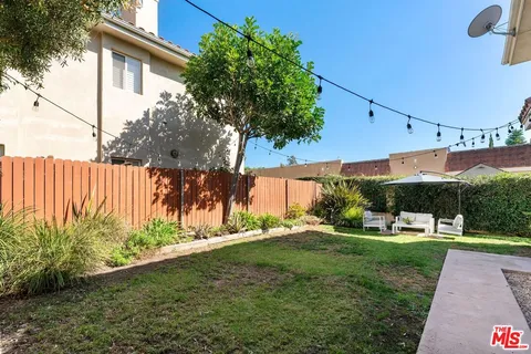a view of a backyard with plants