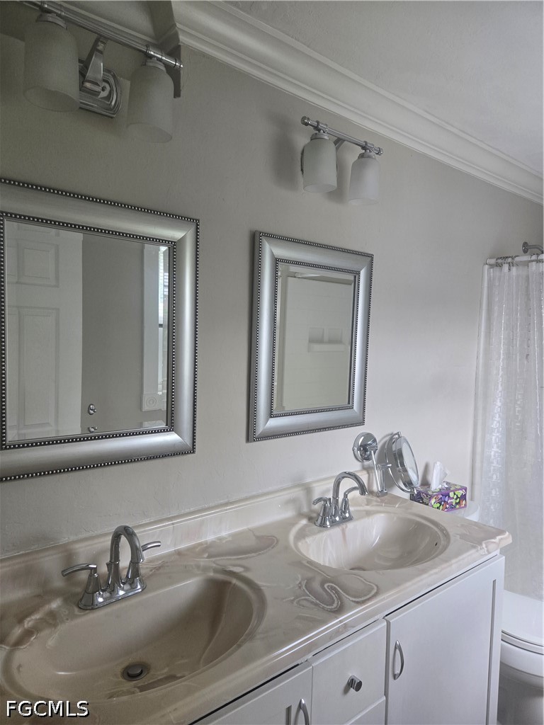 8093 Anhinga Road Fort Myers, FL 33967 - Photo 21 of 49 a bathroom with a sink and a mirror