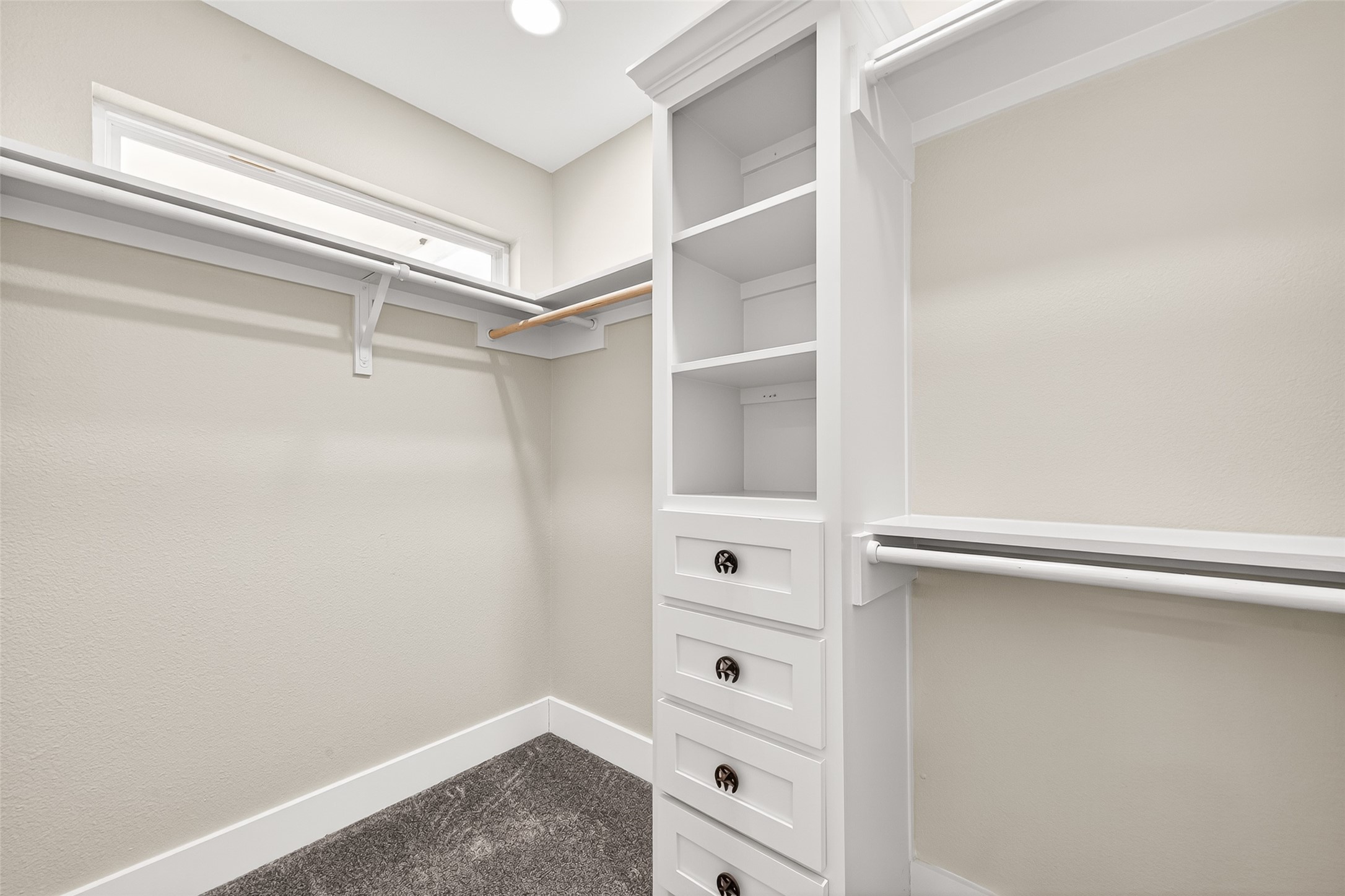 803 County Road 772 Damon, TX 77430 - Photo 27 of 50 a view of walk in closet with empty racks