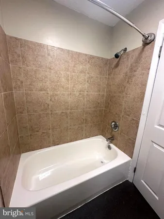 a bathroom with a white bath tub