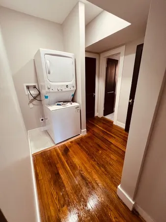 a bedroom with a bed and mirror