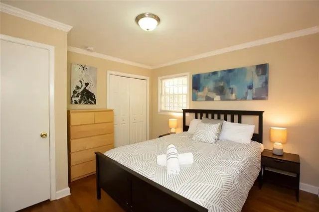 a bedroom with a bed and a dresser