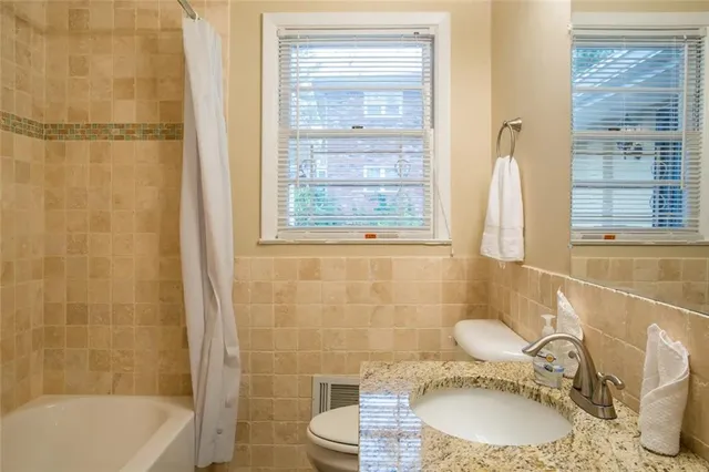 a bathroom with a sink toilet a shower and bathtub