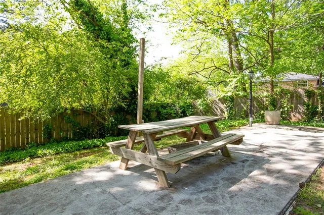 a wooden bench sitting in the middle of a park