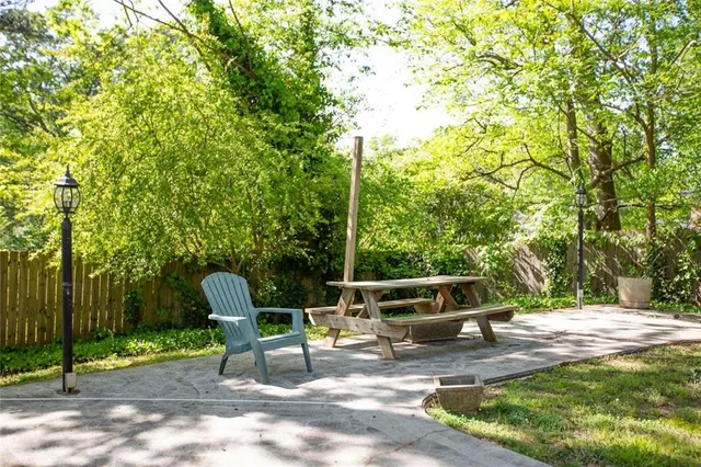 a view of a bench in a backyard