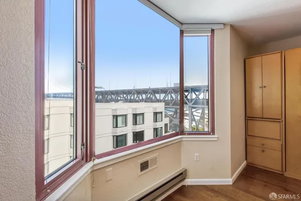 a view of a kitchen with a sink and wooden floor