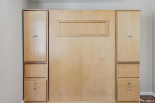 a kitchen with a refrigerator and a sink