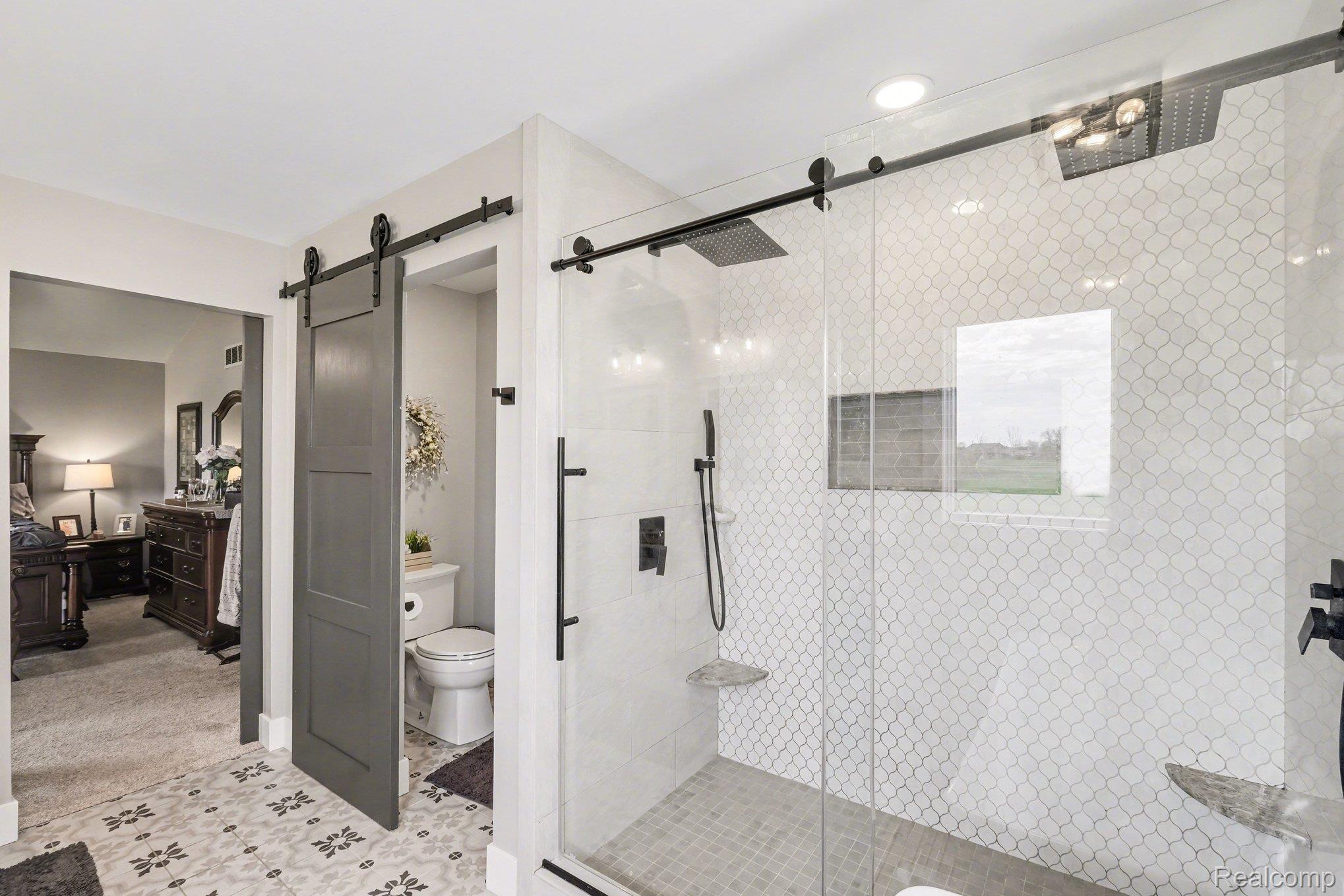 9084 Copper Ridge Drive Davison, MI 48423 - Photo 24 of 42 Bathroom featuring a stall shower, light carpet, and ensuite bath