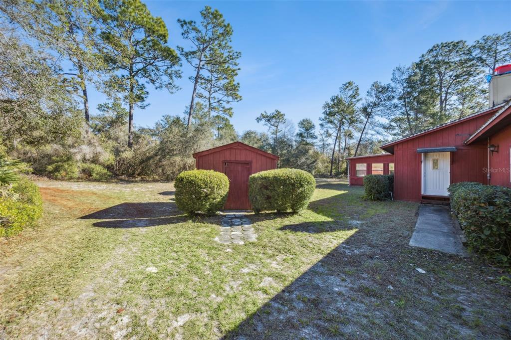 175 Bull Run Avenue Osteen, FL 32764 - Photo 4 of 41 a view of a house with backyard and sitting area