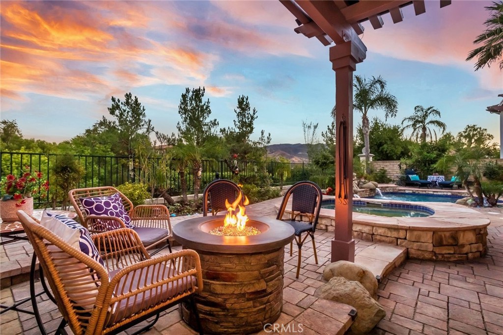 25808 Tennyson Lane Stevenson Ranch, CA 91381 - Photo 2 of 74 a view of a patio with a table chairs and a table