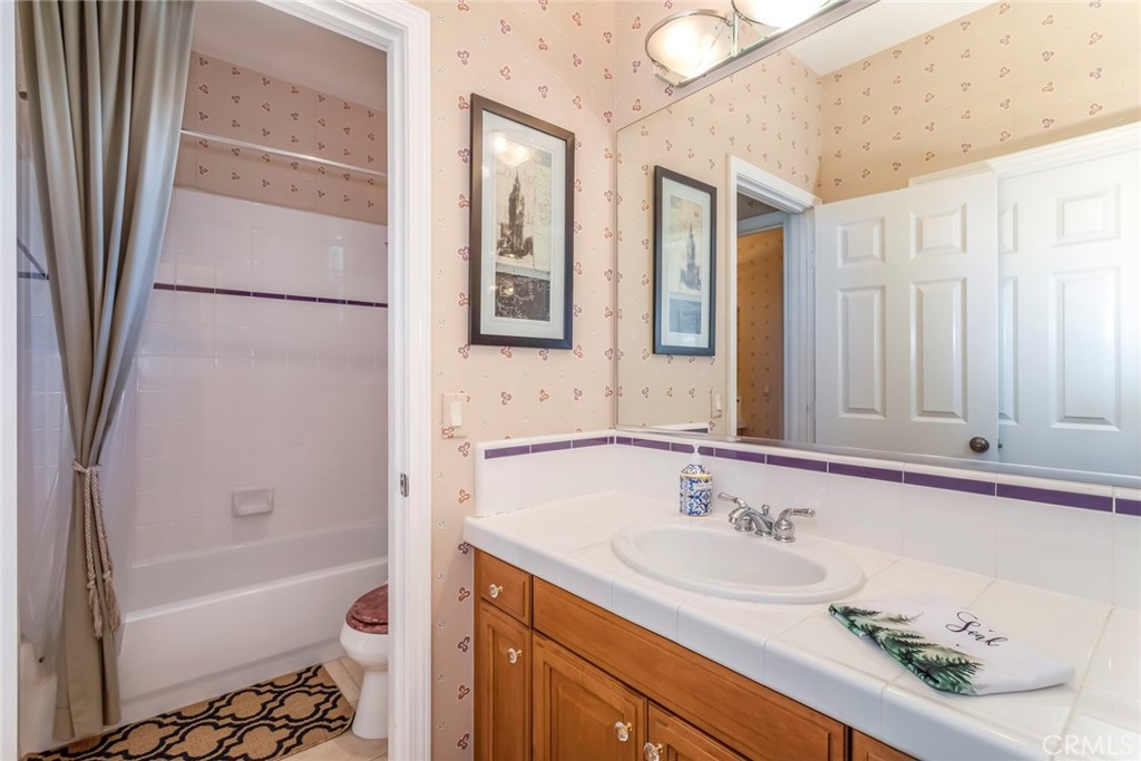 25808 Tennyson Lane Stevenson Ranch, CA 91381 - Photo 40 of 74 a bathroom with a sink a bathtub and a mirror