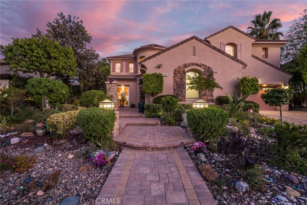 25808 Tennyson Lane Stevenson Ranch, CA 91381 - Photo 61 of 74 a front view of a house with a yard