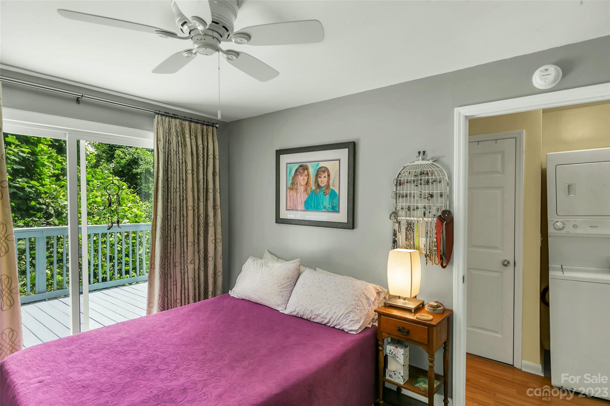 83 East View Street Marion, NC 28752 - Photo 11 of 24 a bedroom with a bed and a chandelier
