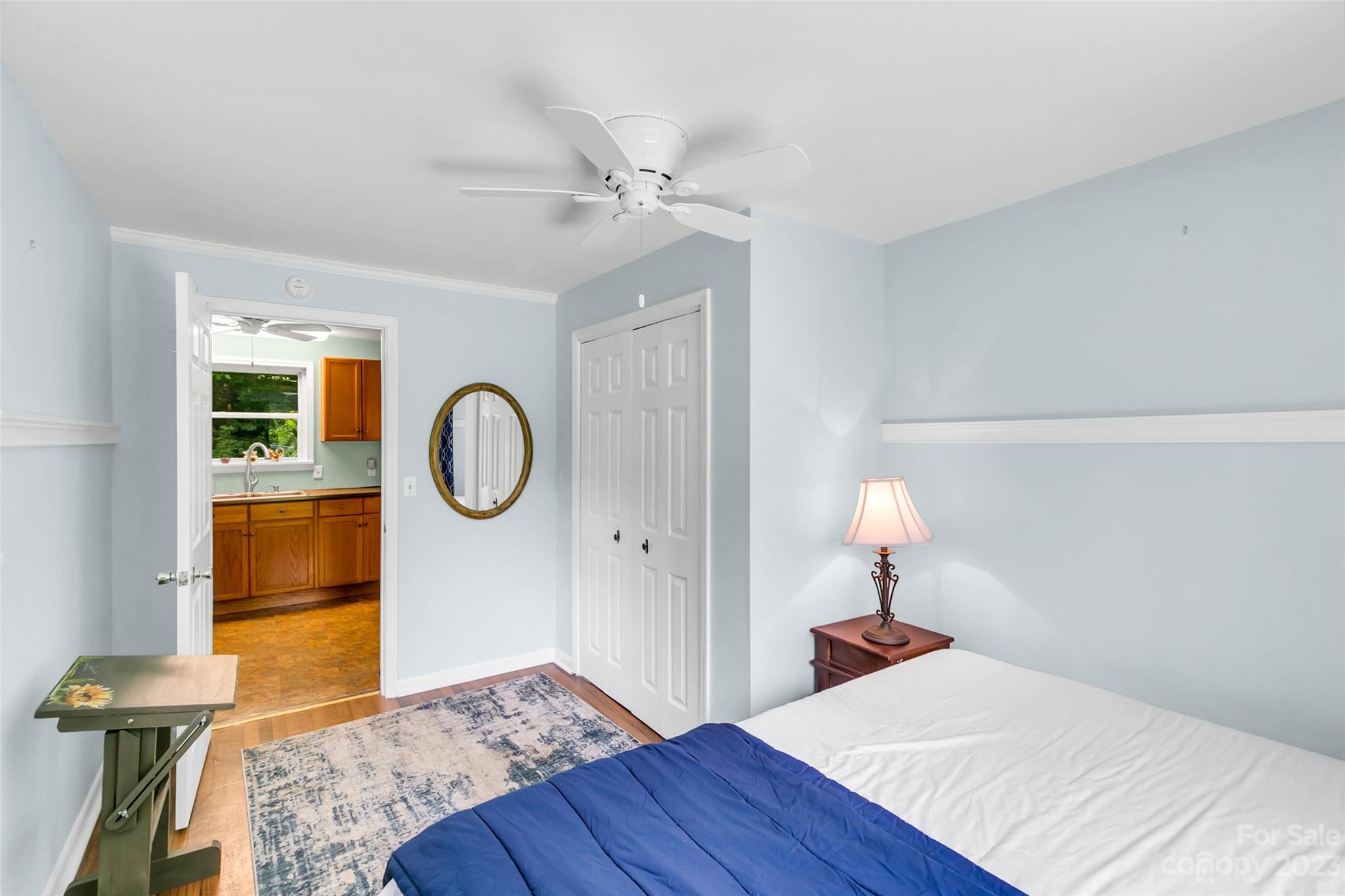 83 East View Street Marion, NC 28752 - Photo 14 of 24 a bedroom with a bed and a chandelier