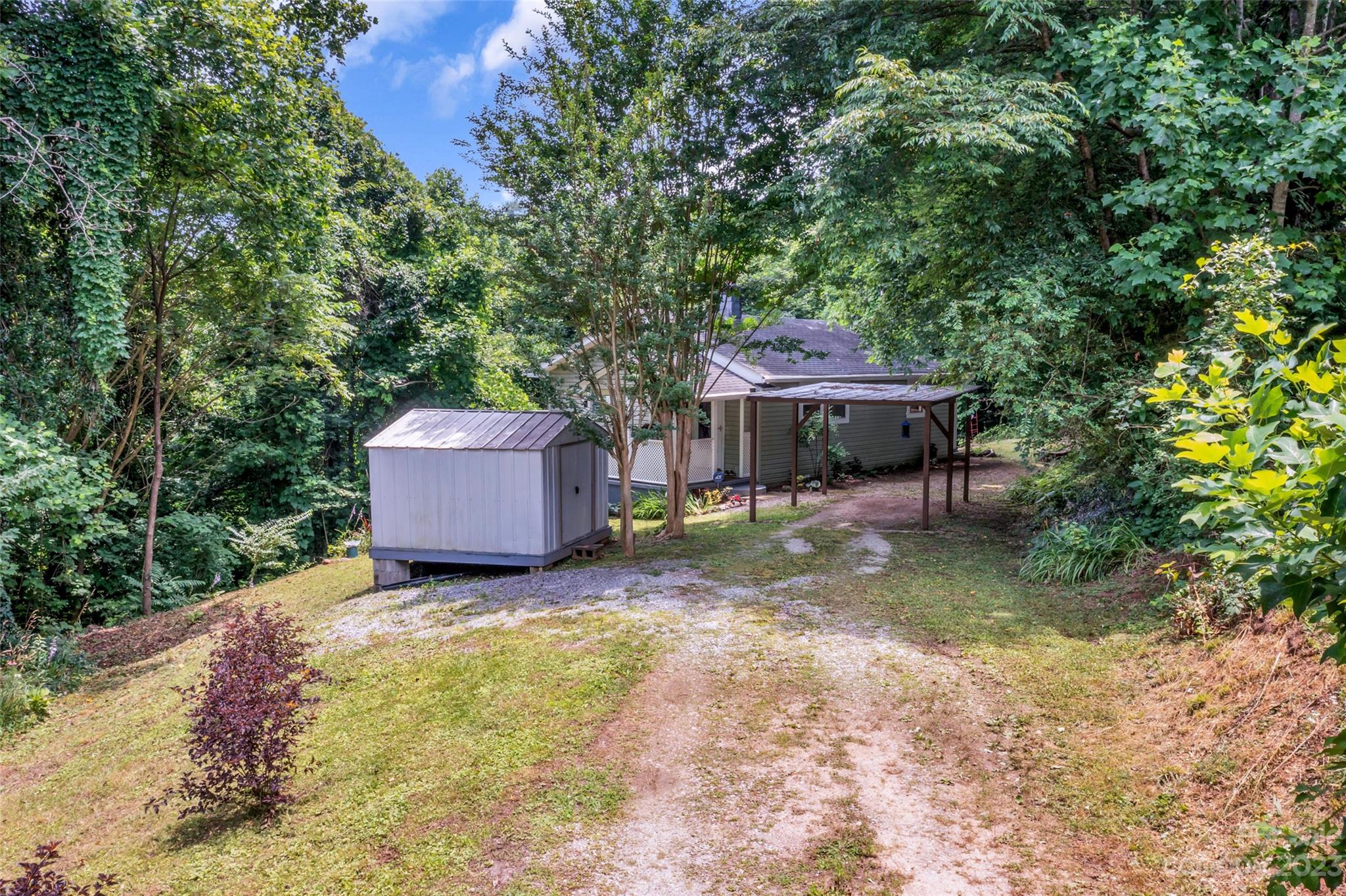 83 East View Street Marion, NC 28752 - Photo 19 of 24 a backyard of a house with table and chairs