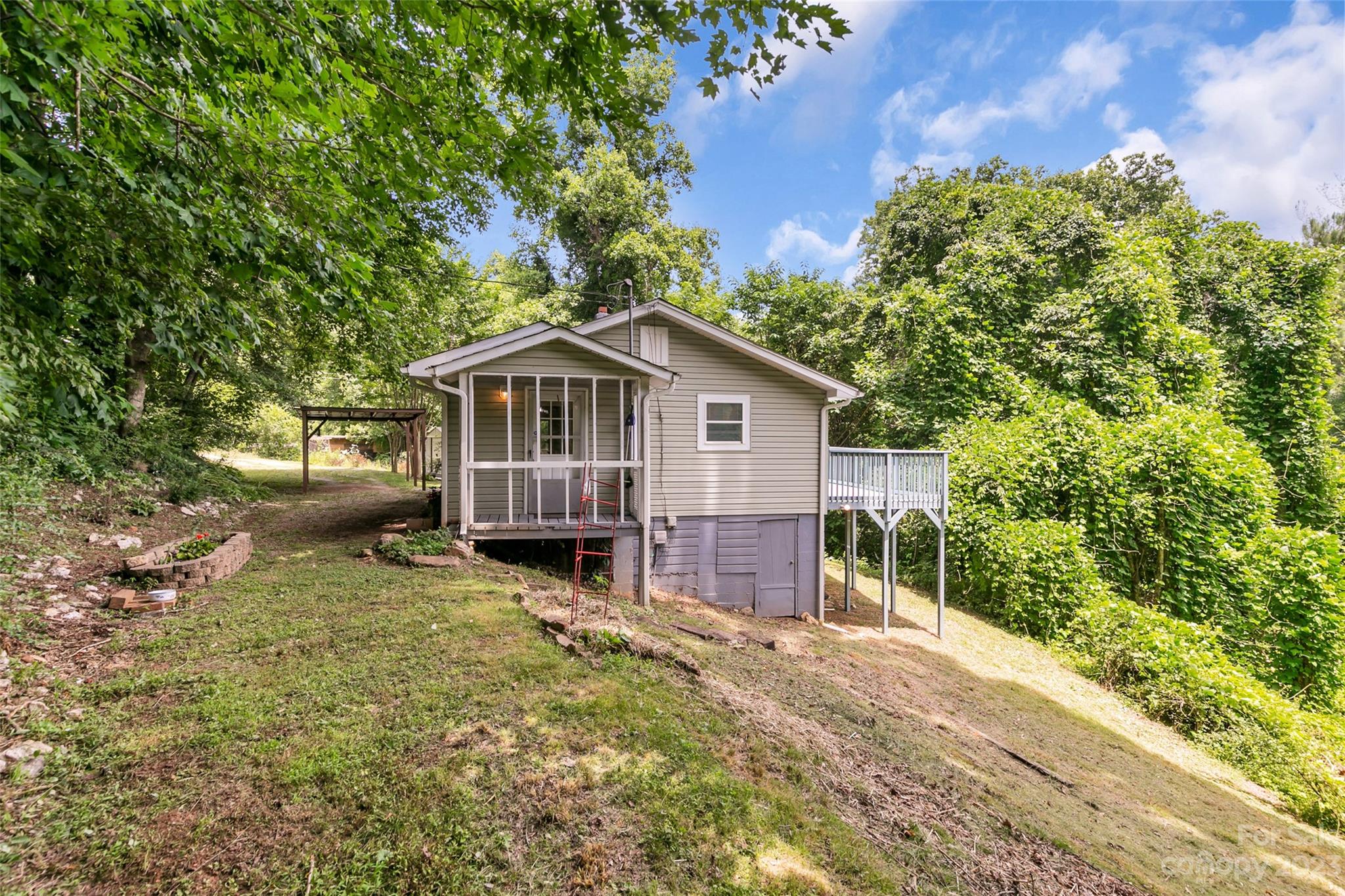 83 East View Street Marion, NC 28752 - Photo 20 of 24 a view of a house with a yard