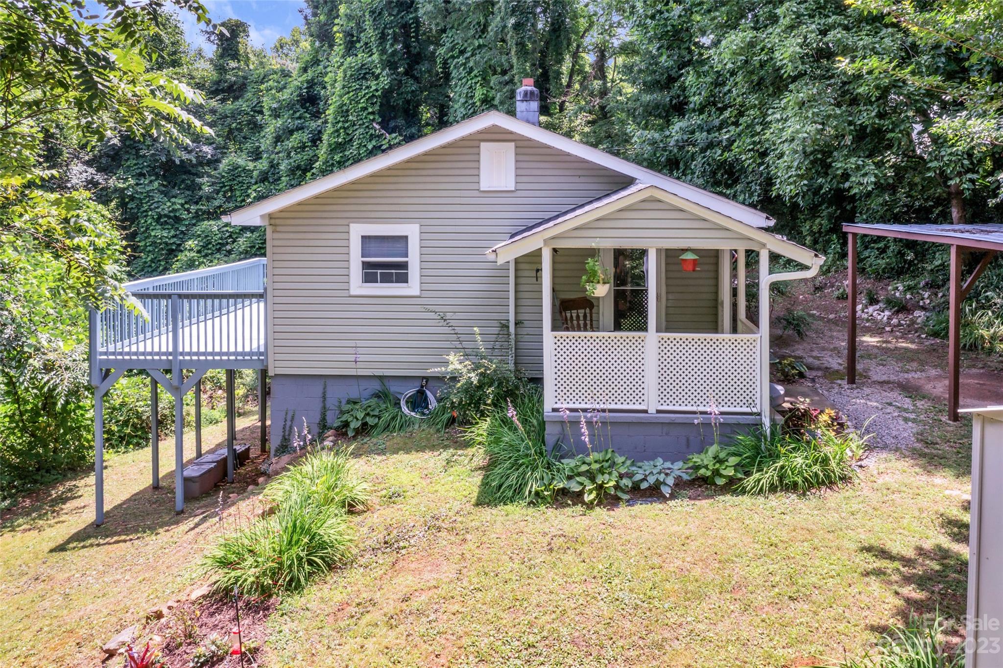 83 East View Street Marion, NC 28752 - Photo 2 of 24 a front view of a house with garden