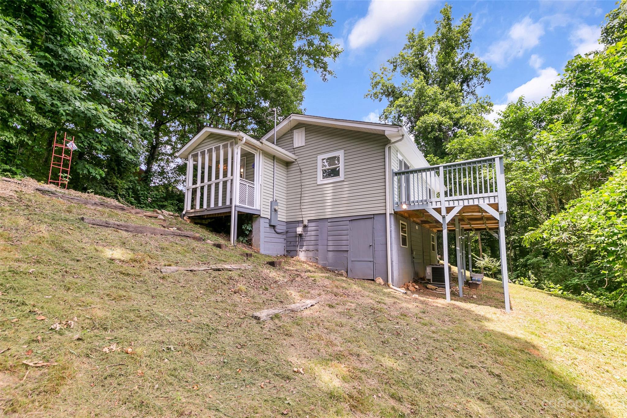 83 East View Street Marion, NC 28752 - Photo 21 of 24 a front view of a house with a yard and garage