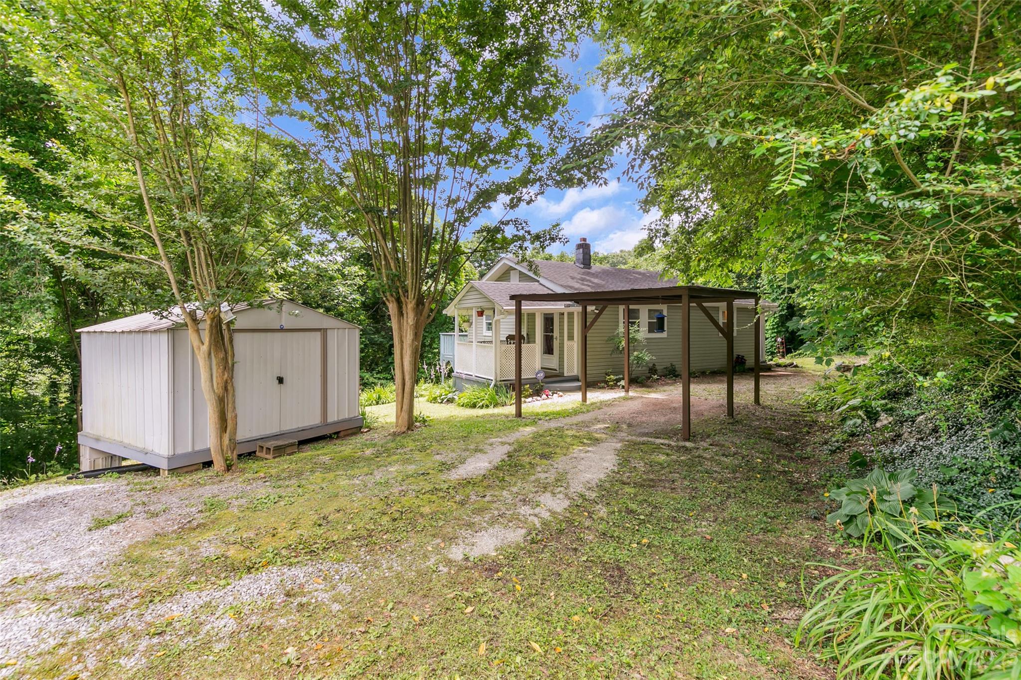 83 East View Street Marion, NC 28752 - Photo 22 of 24 a house with trees in the background