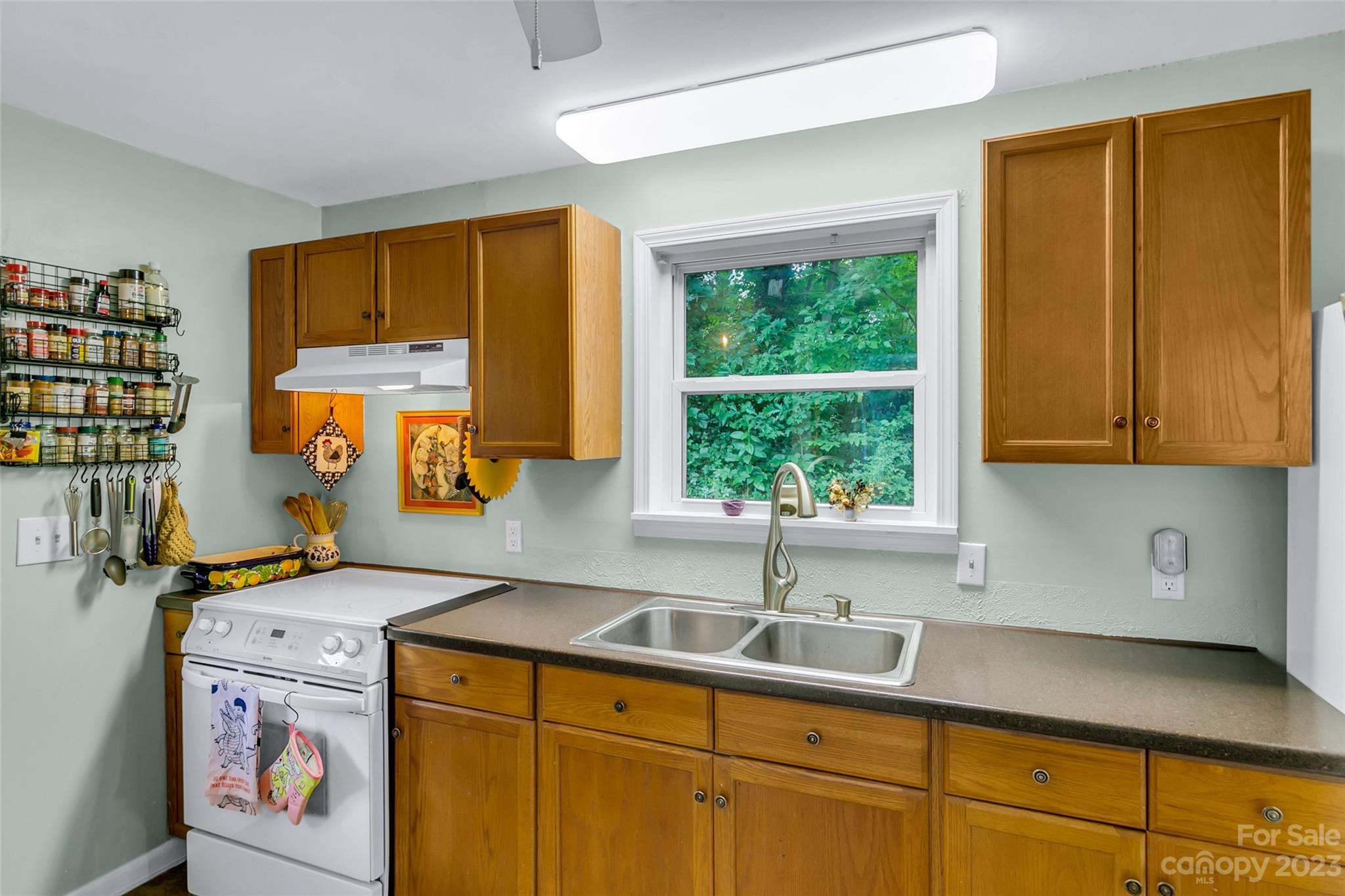 83 East View Street Marion, NC 28752 - Photo 10 of 24 a utility room with stainless steel appliances granite countertop a sink and a cabinets