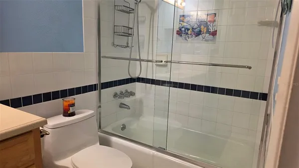 a bathroom with a shower and toilet