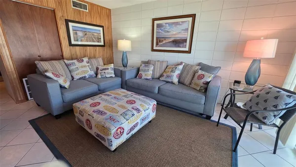 a view of bedroom with a flat tv screen and dresser