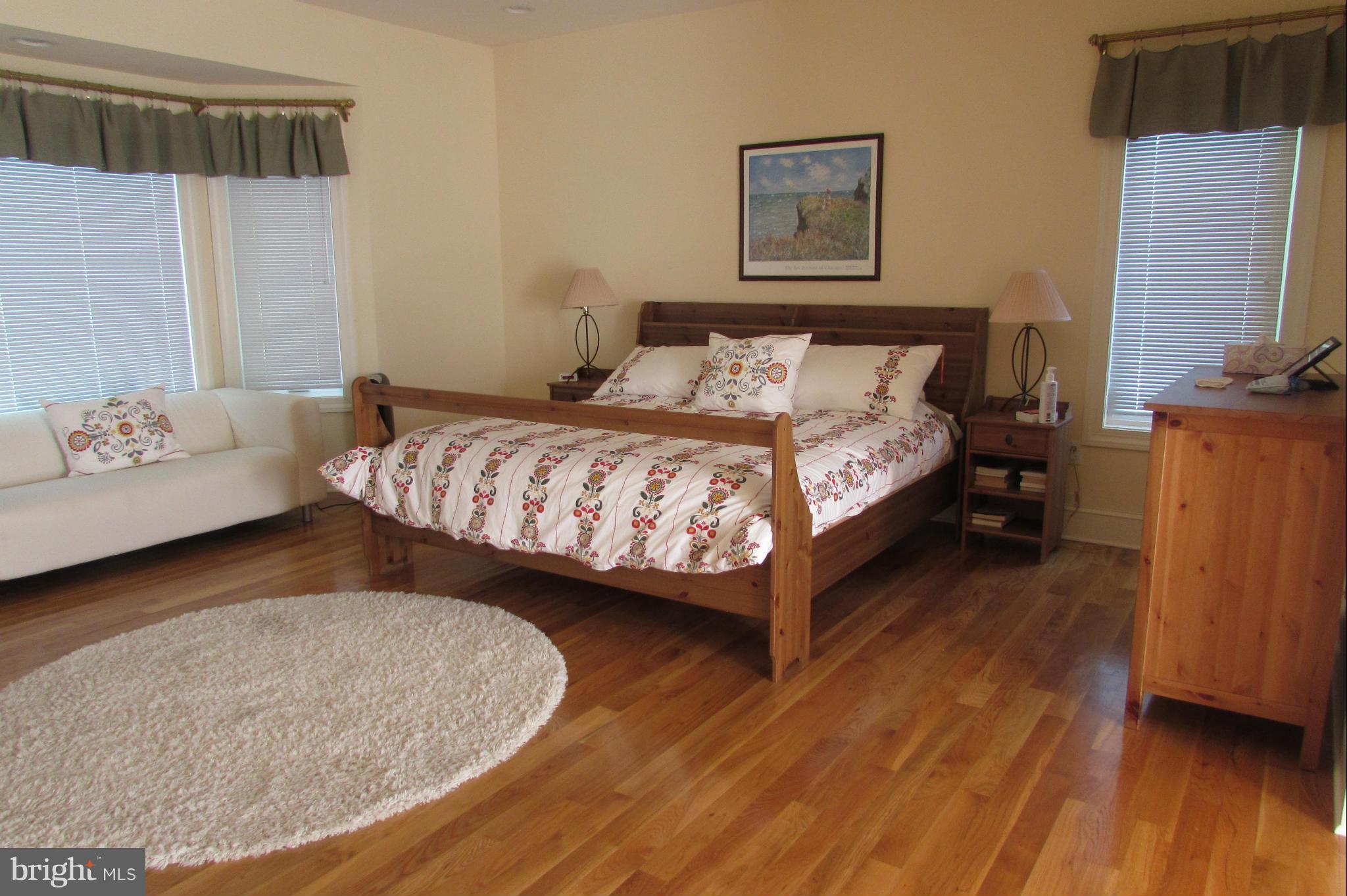 201 Greenwood Creek Road Queenstown, MD 21658 - Photo 11 of 25 a bedroom with a bed couch and a window