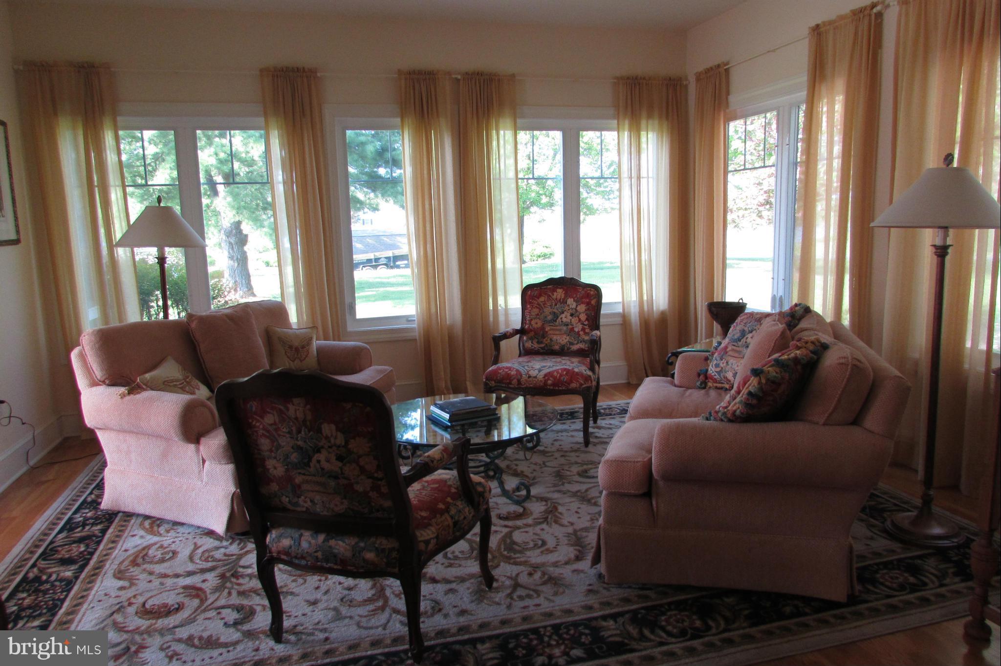 201 Greenwood Creek Road Queenstown, MD 21658 - Photo 13 of 25 a living room with furniture and a large window