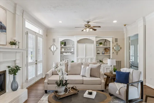 a living room with furniture fireplace and a fireplace