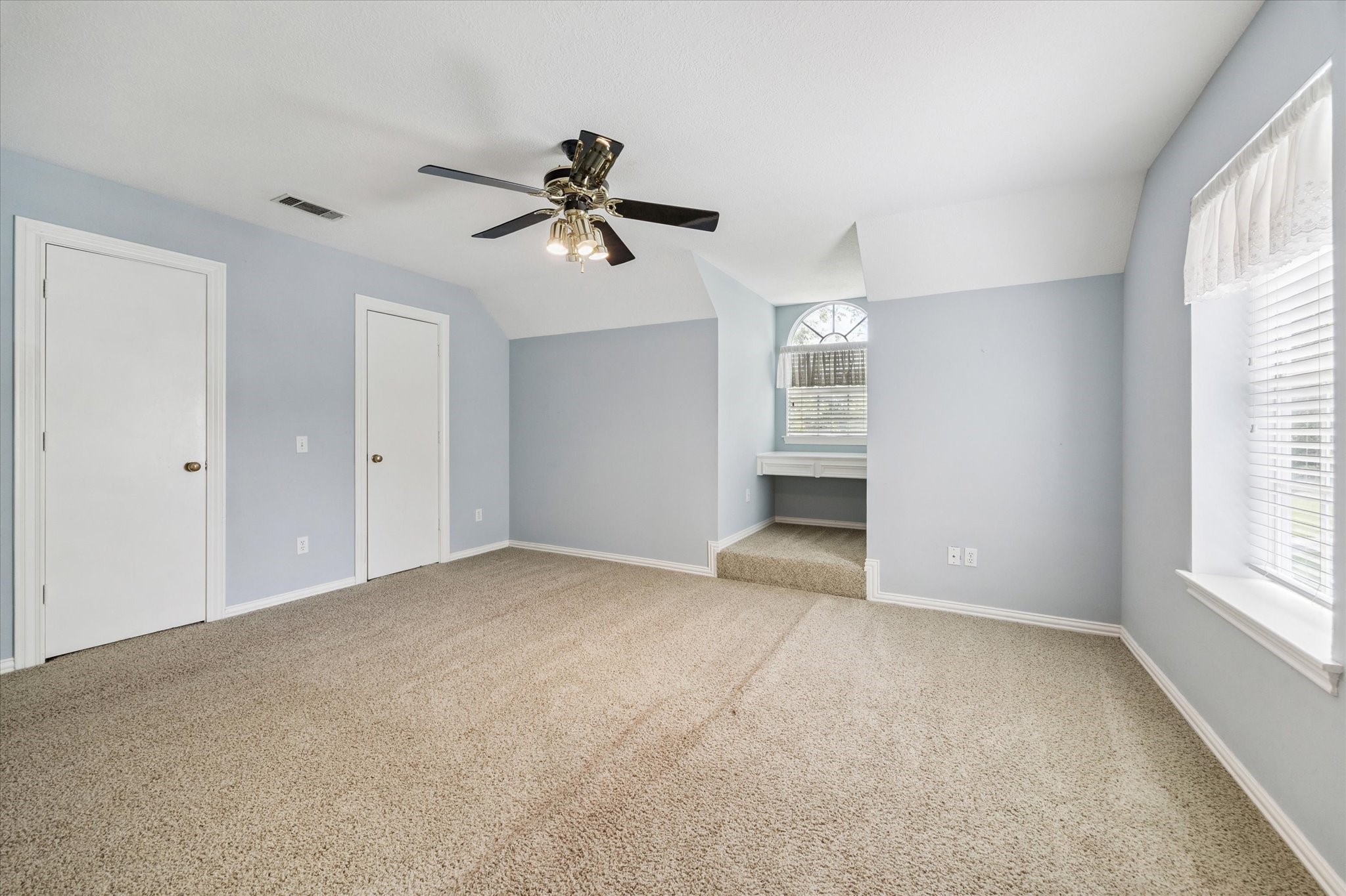 2 Katy Hockley Road Katy, TX 77493 - Photo 28 of 46 a view of empty room with windows and ceiling fan