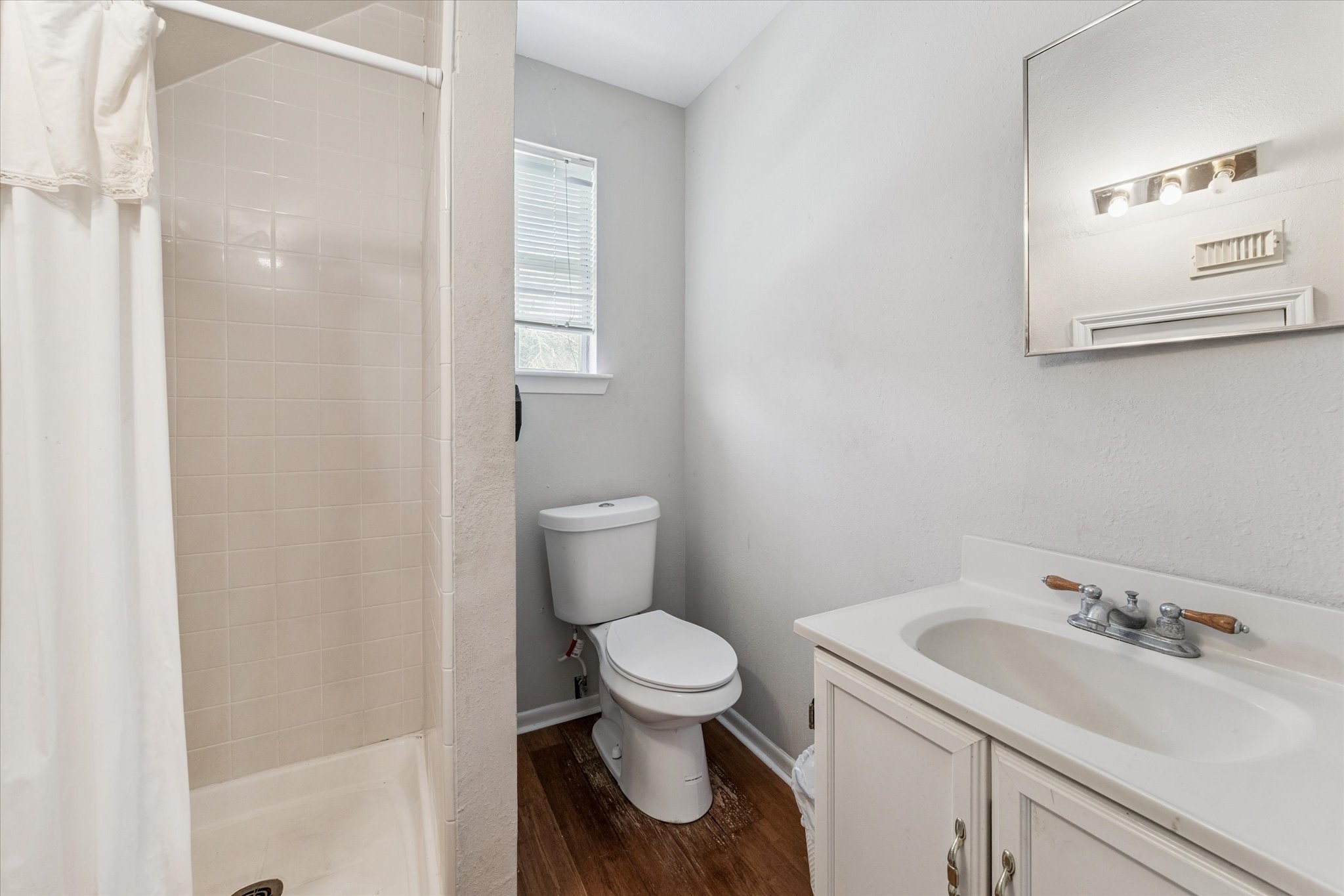 2 Katy Hockley Road Katy, TX 77493 - Photo 32 of 46 a bathroom with a sink a toilet and a mirror