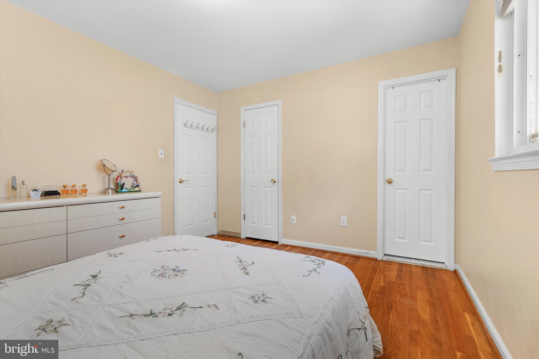 8304 Harland Drive Springfield, VA 22152 - Photo 18 of 39 a bedroom with a bed and cabinets