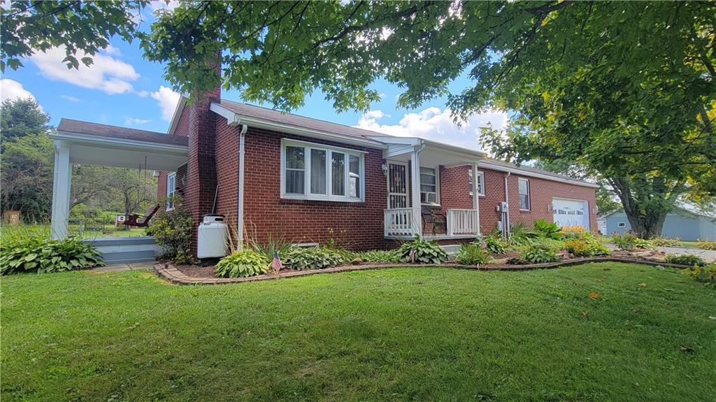 1245 Blacks Hill Road Boswell, PA 15531 - Photo 1 of 48 a front view of a house with garden