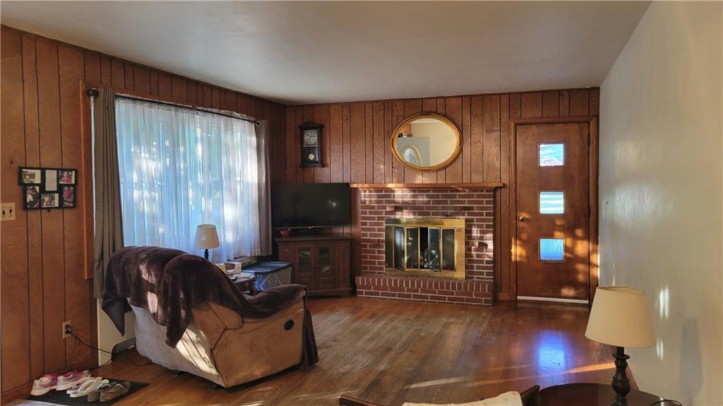 1245 Blacks Hill Road Boswell, PA 15531 - Photo 11 of 48 a living room with furniture a fireplace and a flat screen tv
