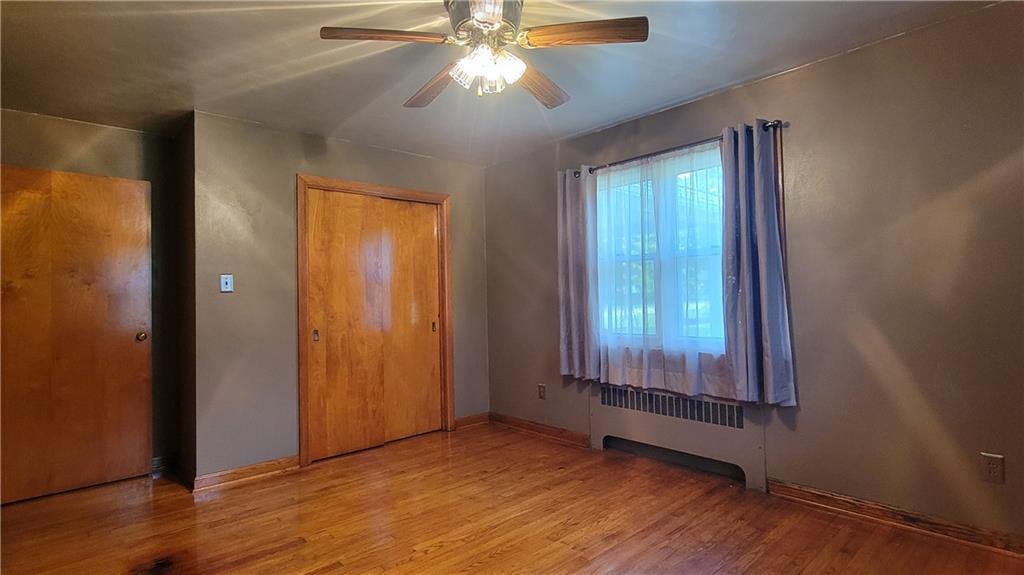 1245 Blacks Hill Road Boswell, PA 15531 - Photo 17 of 48 an empty room with wooden floor and windows
